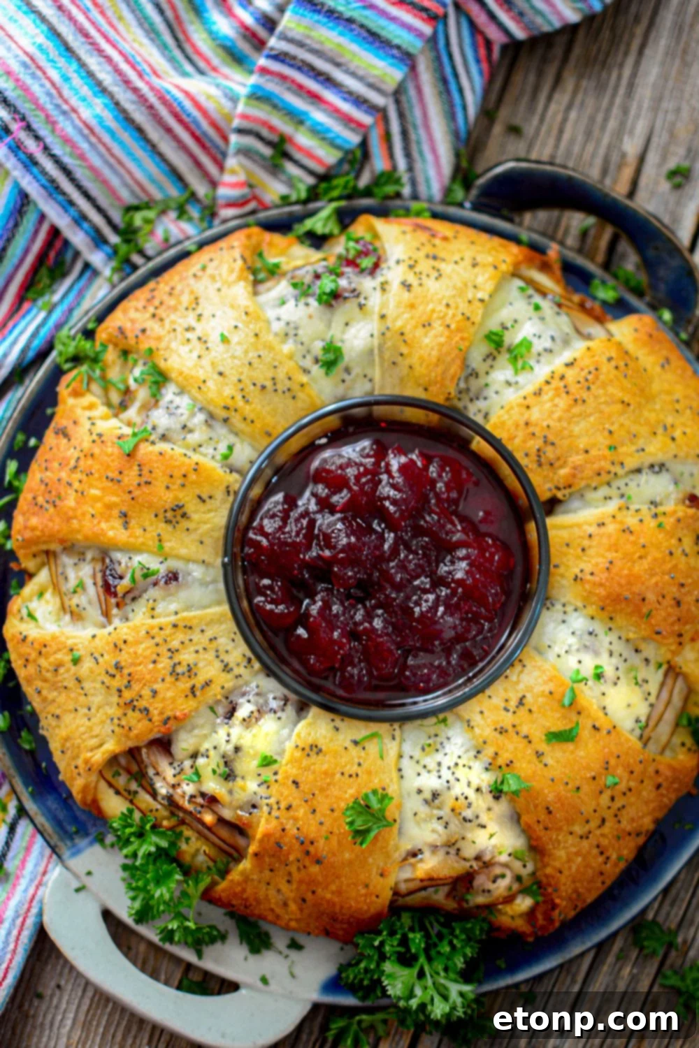 cranberry and turkey crescent wreath on table