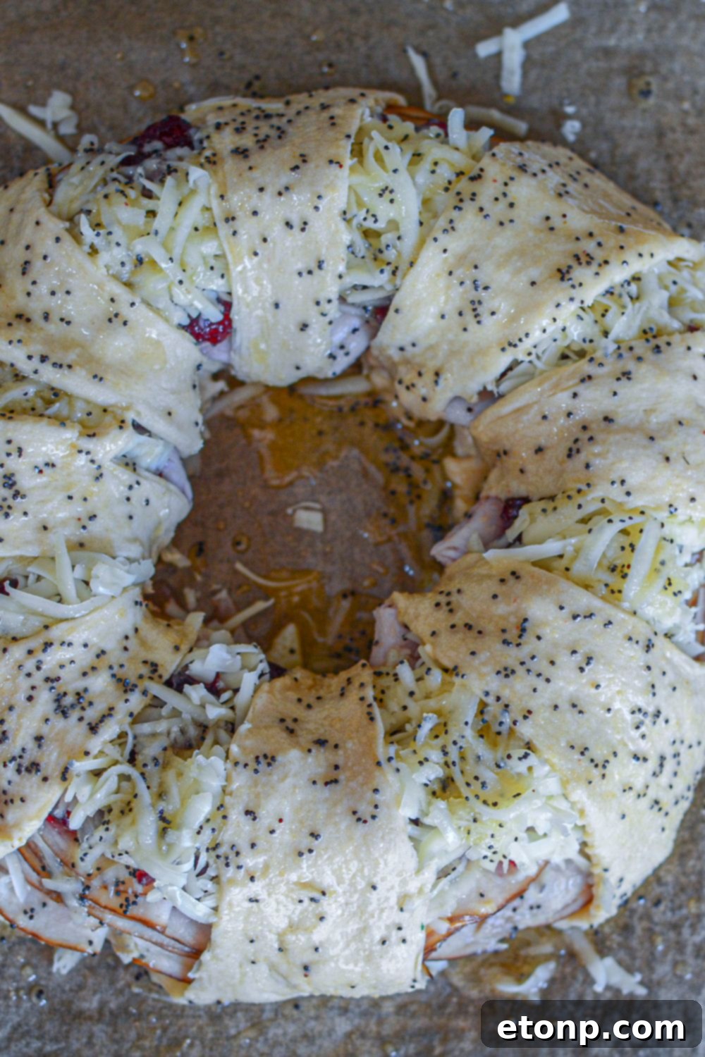 assembled crescent roll on a bkaing sheet