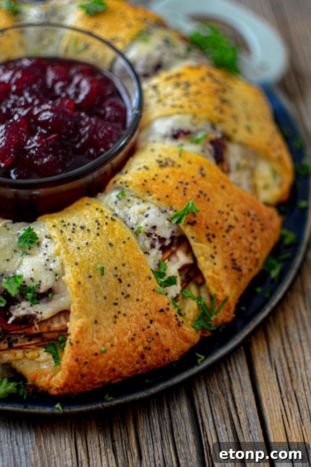 side view of crescent turkey ring on table with cranberry in the center