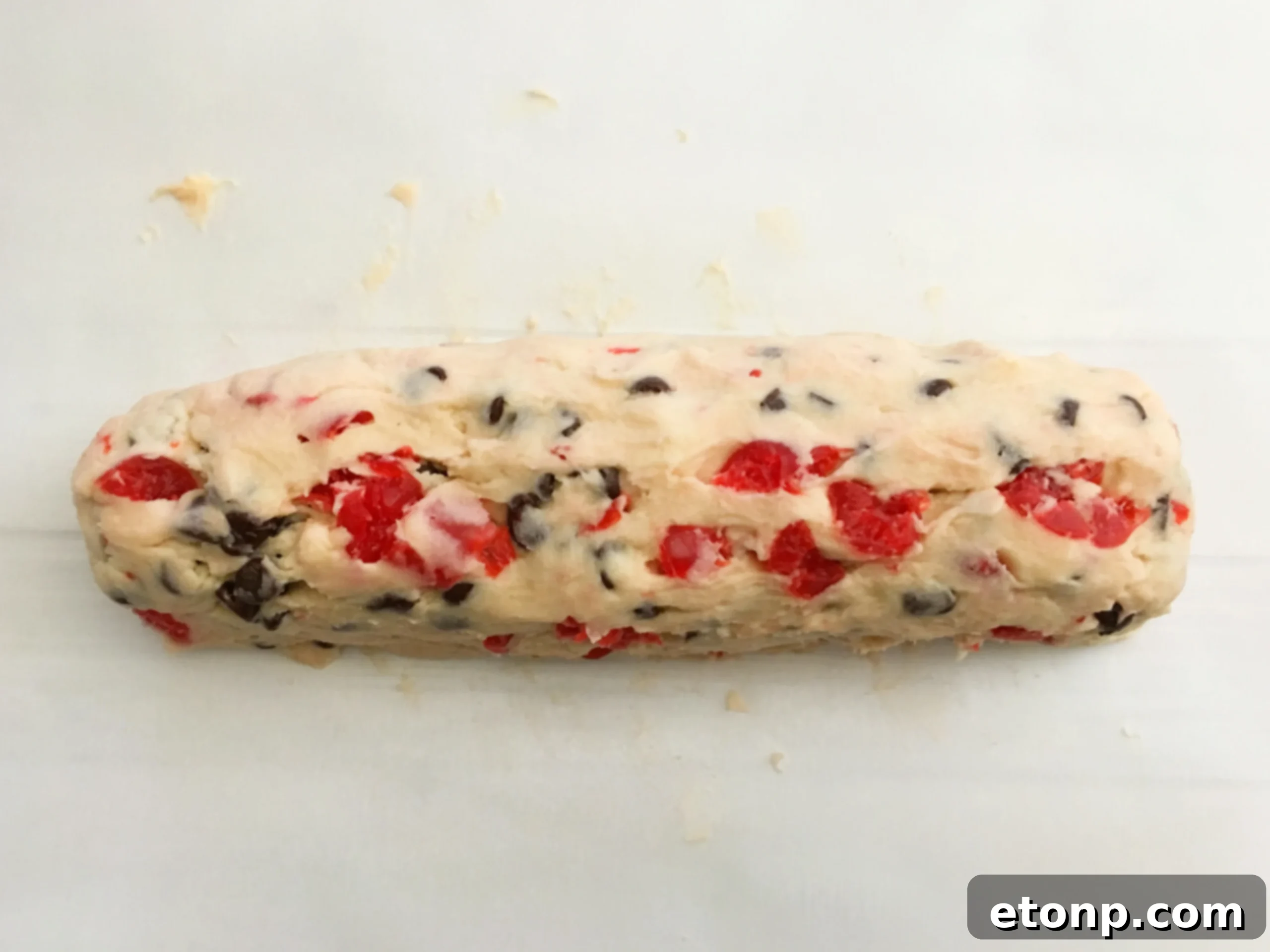 Buttery Maraschino Cherry Christmas Shortbread 6 The cookie dough being shaped into a log, a crucial step for uniform slices.