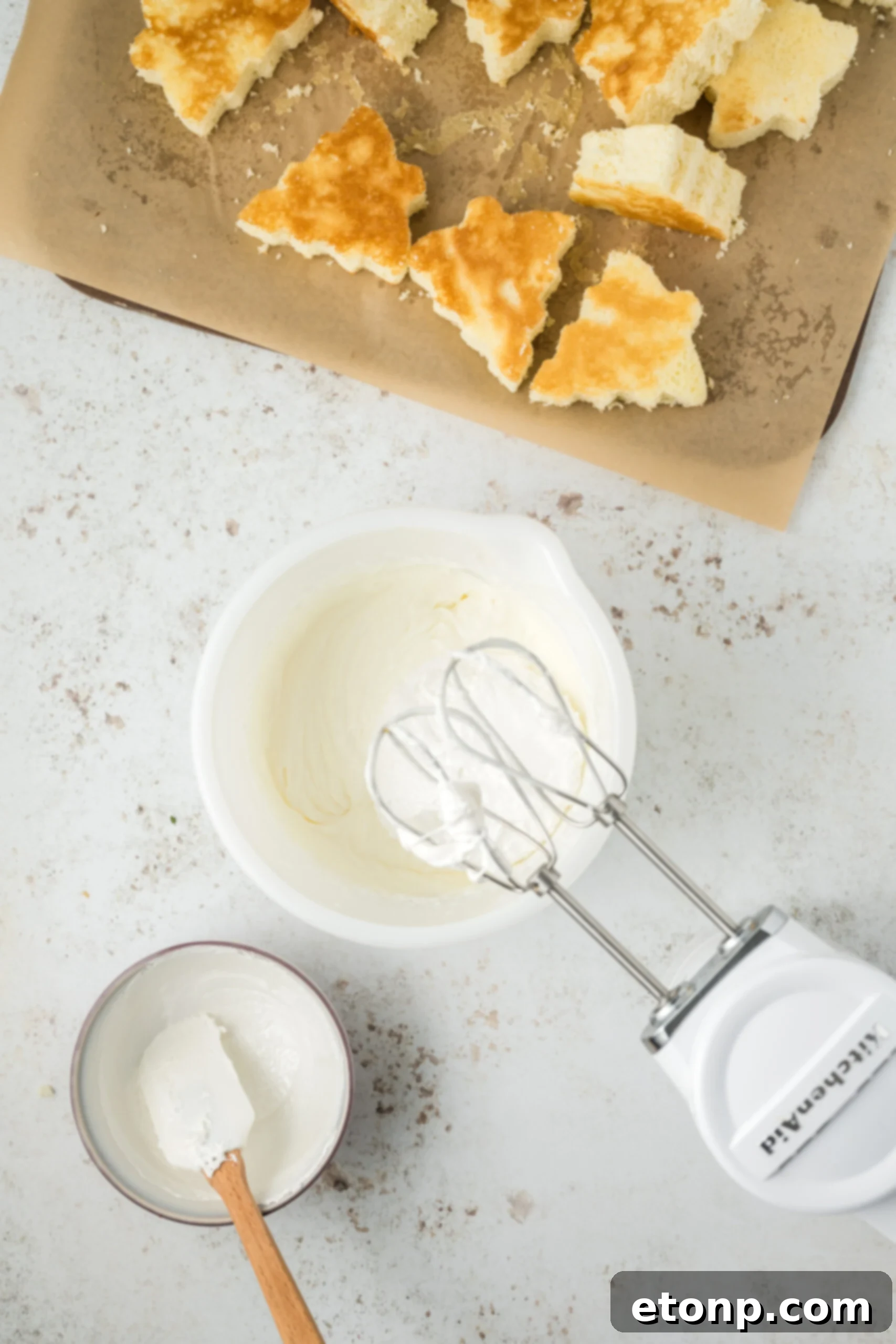 mixing up frosting for the cakes