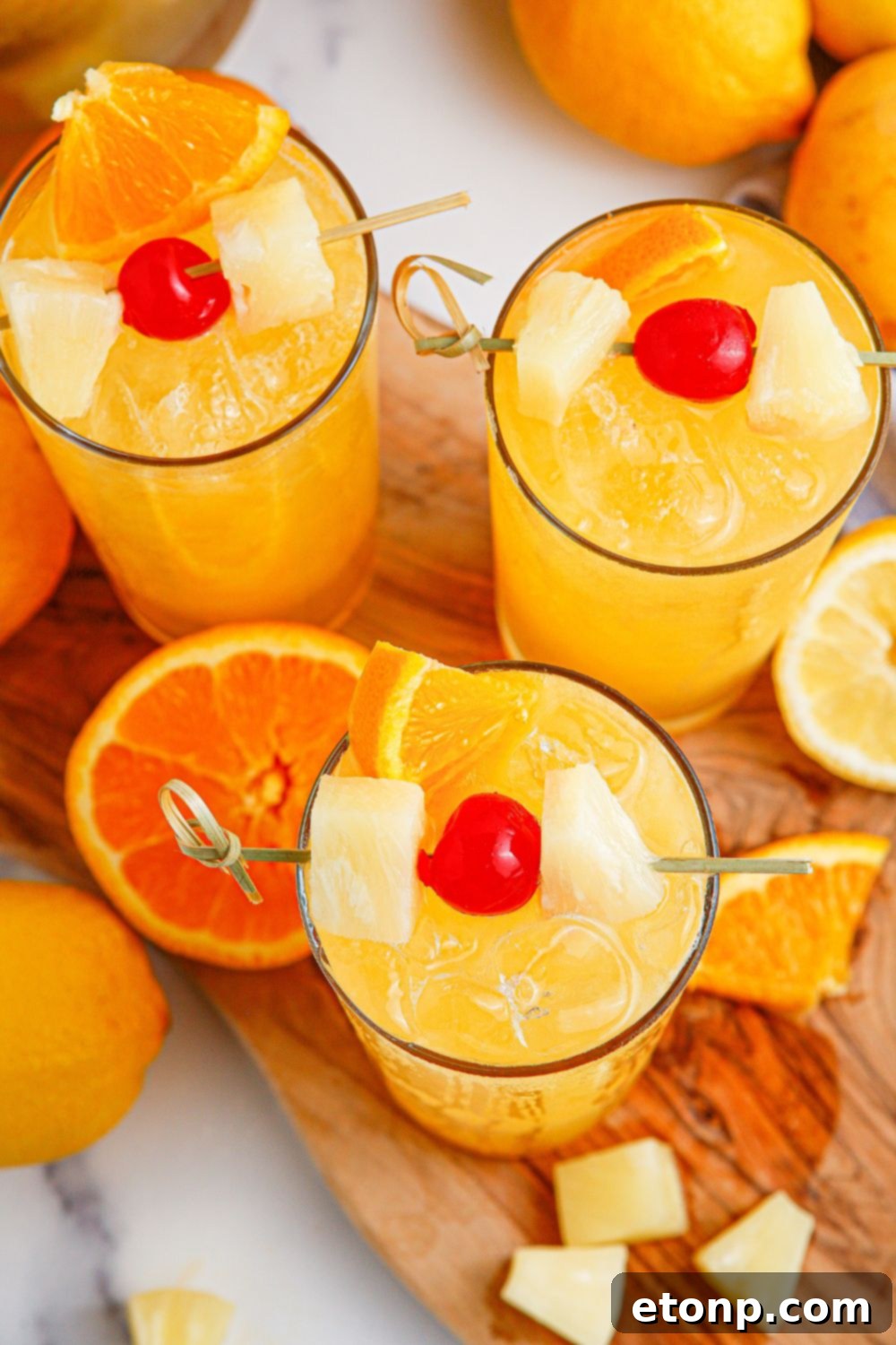 overhead view of party punch on table with cherry garnish on top
