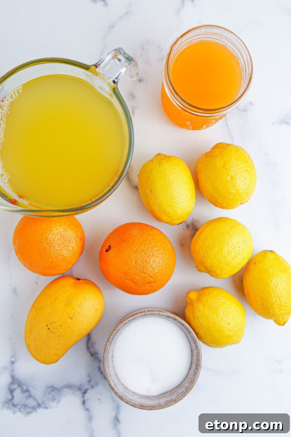 ingredients for making a tropical punch on table