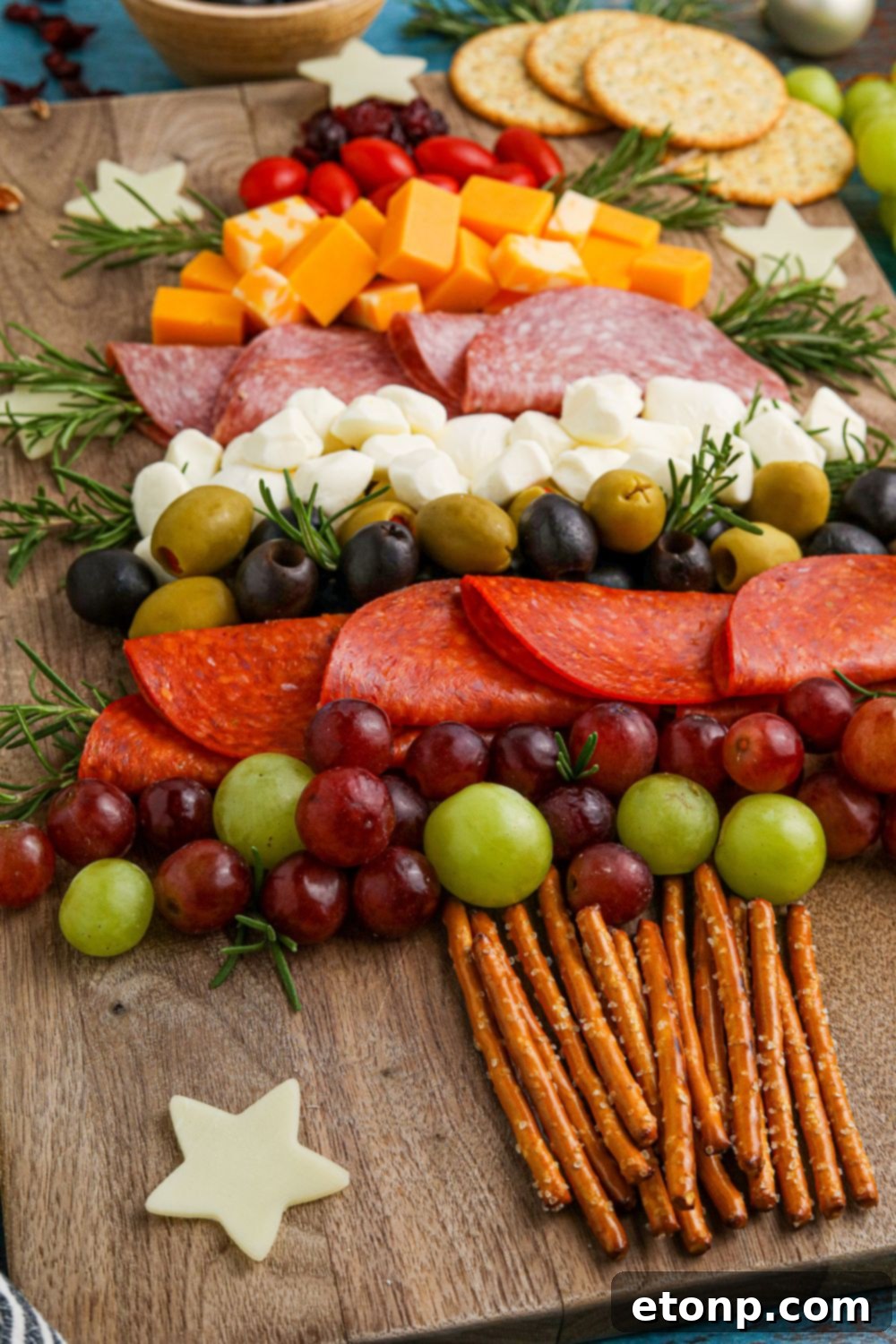 Side view of a piece of the charcuterie board on a table