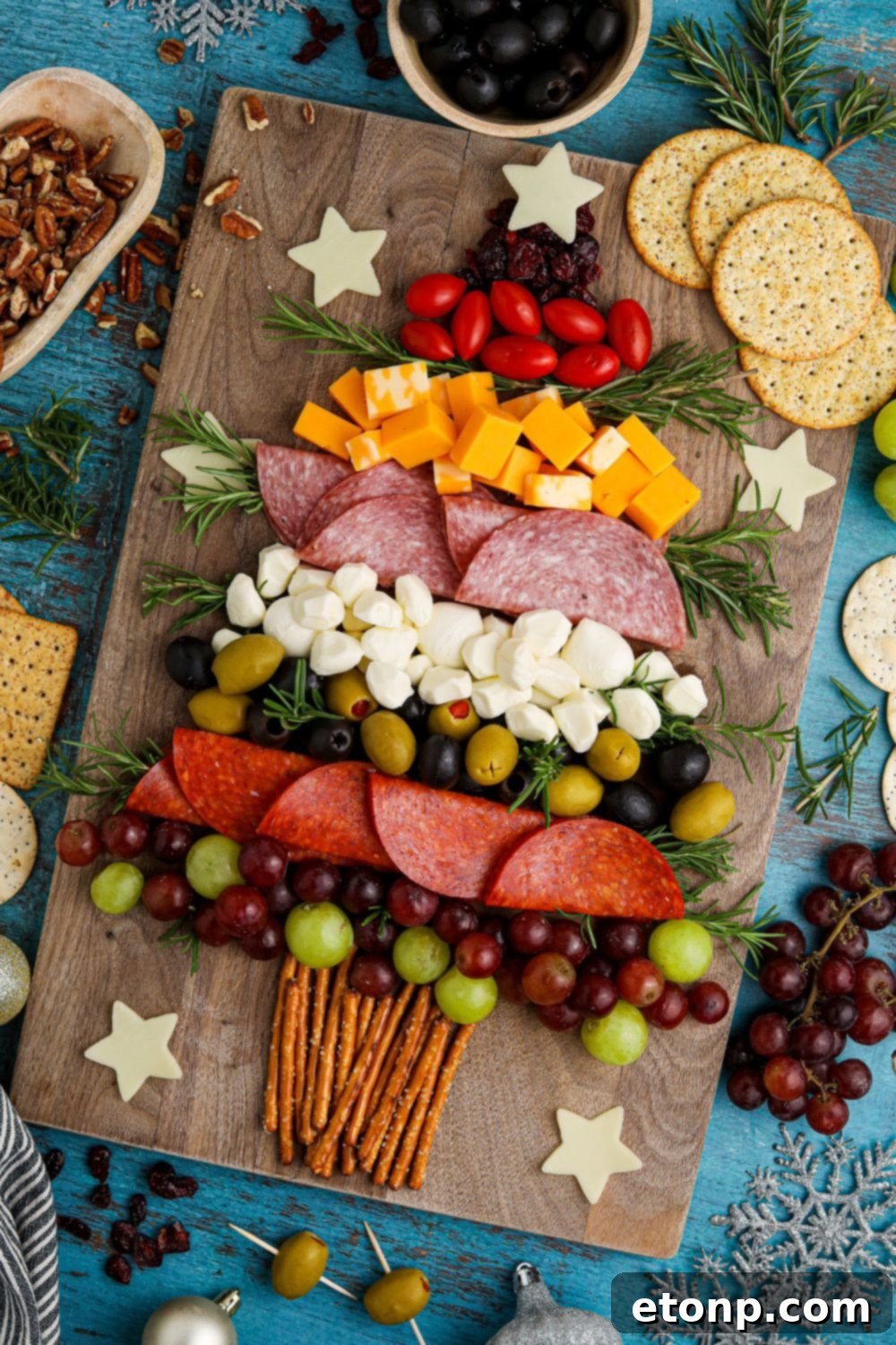 Holiday snack board on a table, showcasing the Christmas tree design