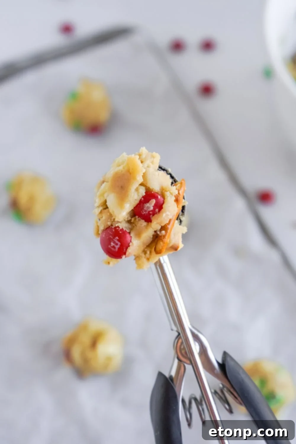 cookie scoop with cookie dough on it
