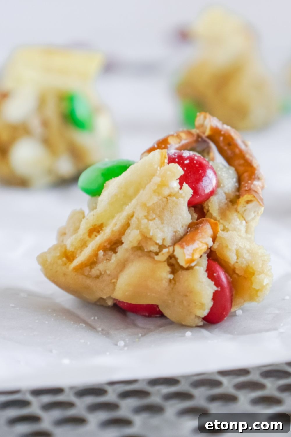 a scoop of cookie dough on baking sheet close up view