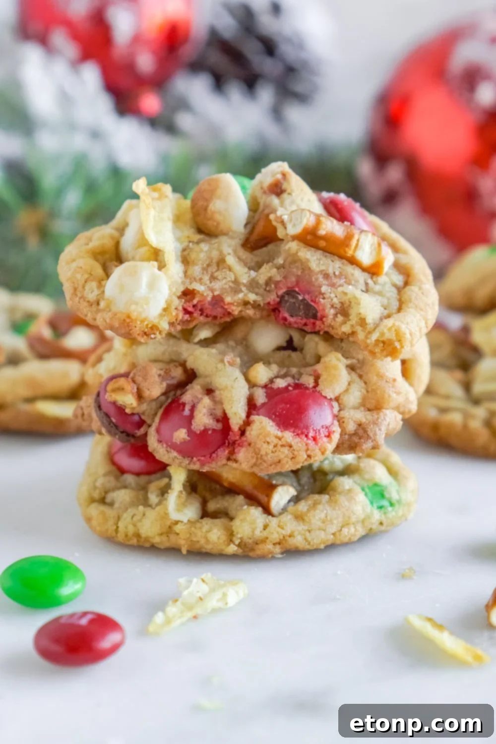 kitchen sink cookies stacked on top of each other with Christmas decorations behind it