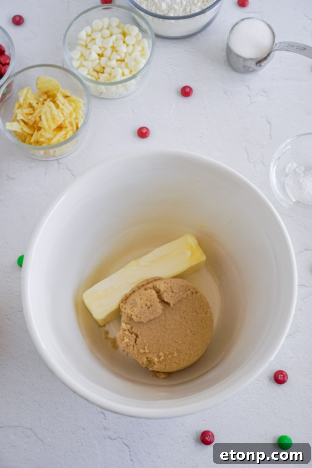 butter and brown sugar in a white mixing bowl