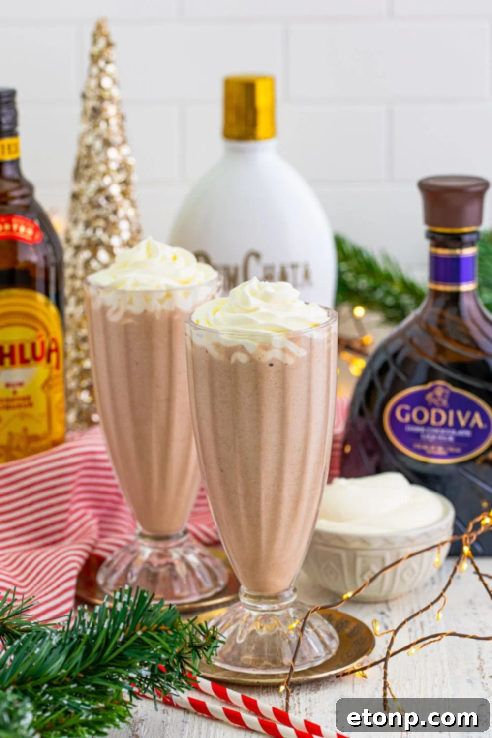 drunk rudolph milkshake in glasses with whipped cream on top