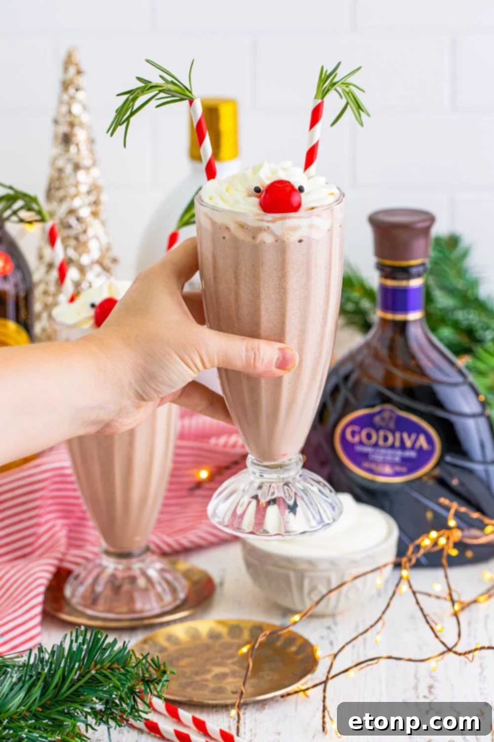 Rudolph Cocktail being held in a hand 