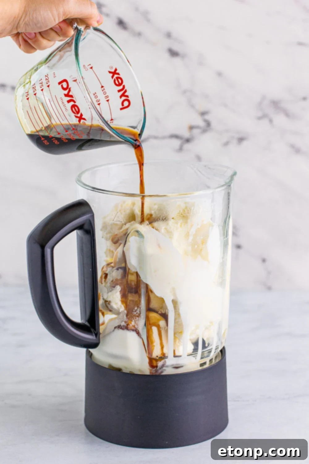 chocolate liquor pouring into blender 