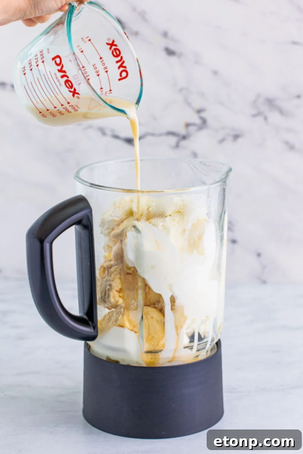 kahlua pouring into blender 