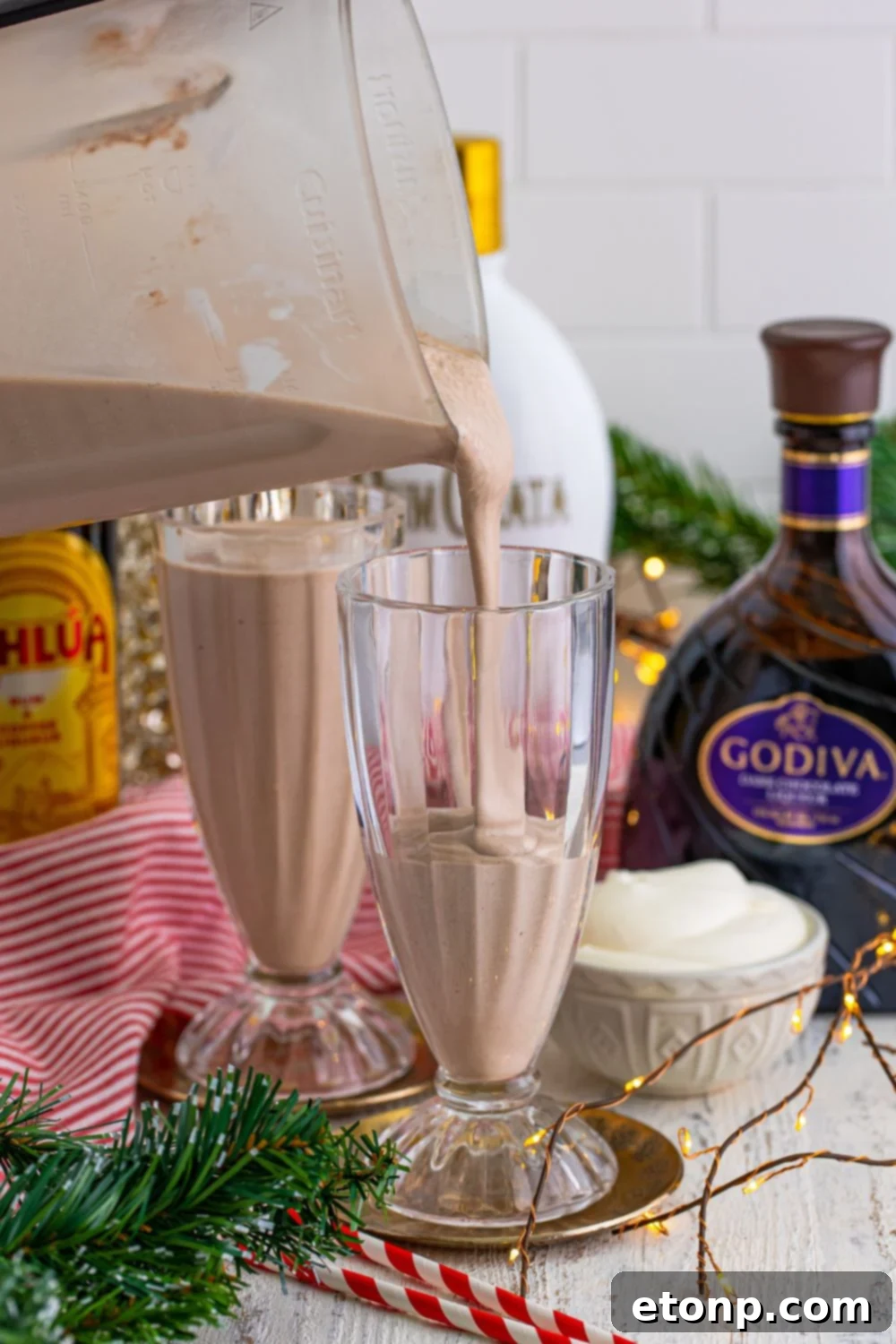 pouring milkshakes into glasses 