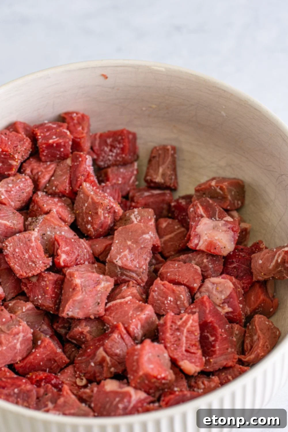 steak and seasonings in a bowl on table 