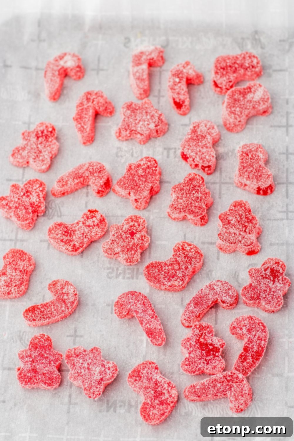 Holiday Gumdrop Gems 14 Vibrant red gumdrops, fully coated in sugar, displayed on a surface