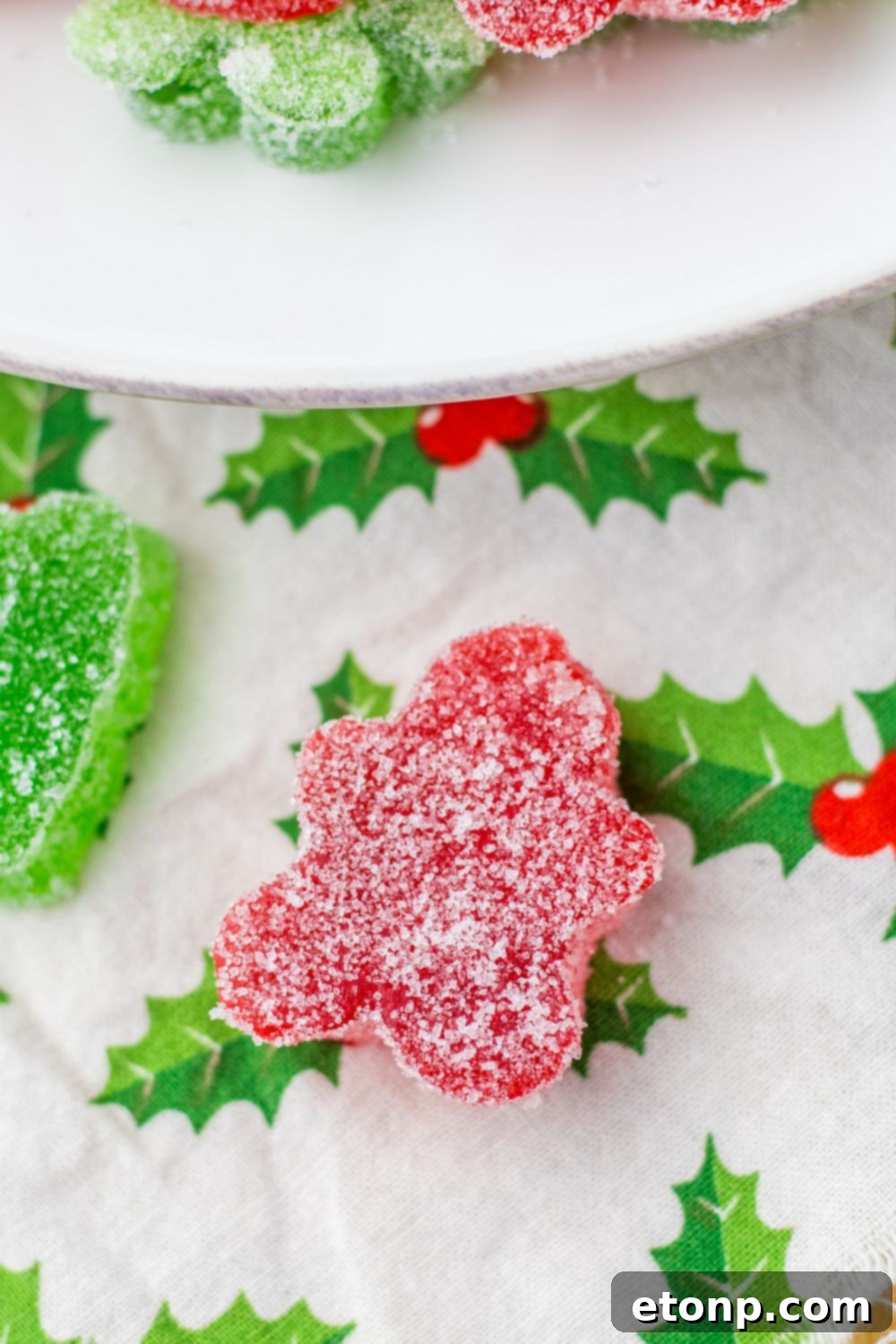 Holiday Gumdrop Gems 23 A Christmas Gumdrop shaped like a gingerbread man, placed on a table