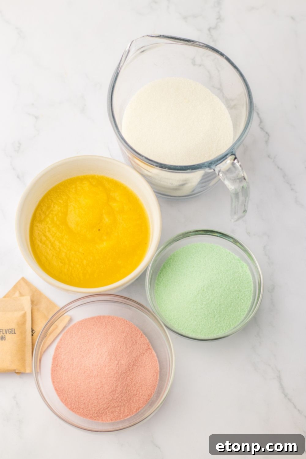 Holiday Gumdrop Gems 6 Ingredients laid out for making homemade gum drops: jello, applesauce, gelatin, and sugar
