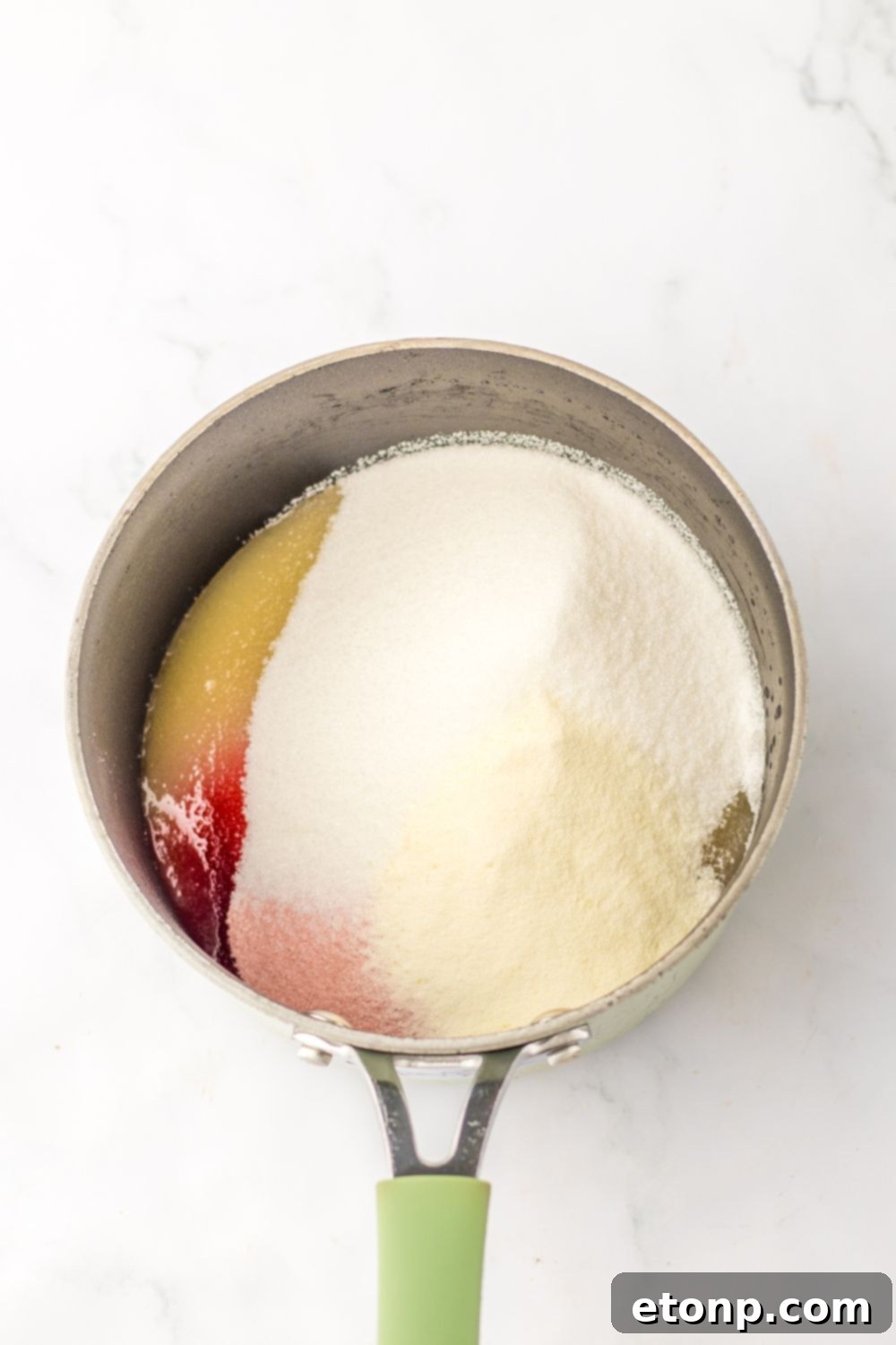 Holiday Gumdrop Gems 7 Gelatin and applesauce mixture simmering in a pan for gummy drops