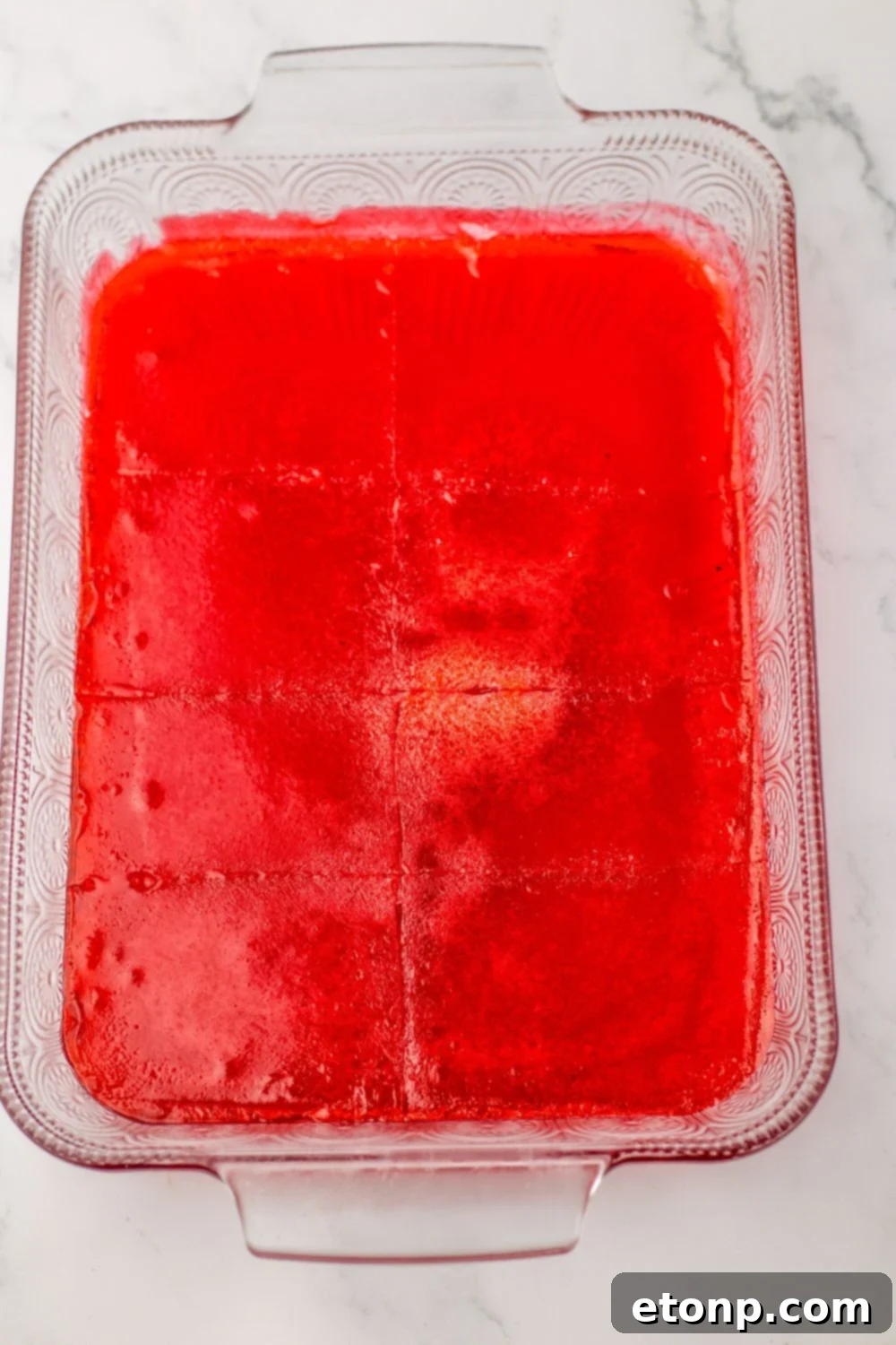 Holiday Gumdrop Gems 10 Red jello mixture in a pan, pre-cut into small squares
