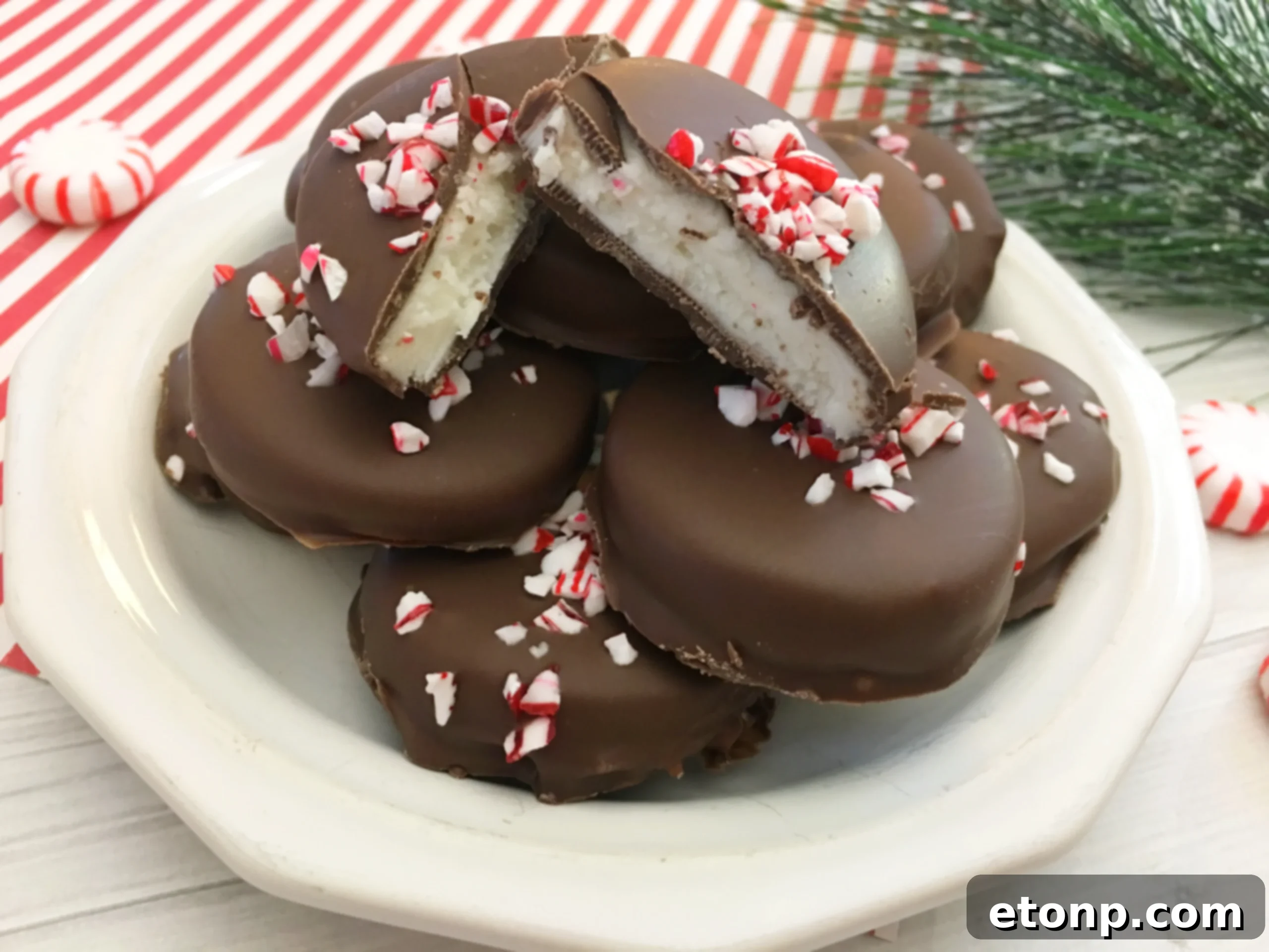 Homemade peppermint patties topped with finely chopped nuts, demonstrating a variation for non-holiday occasions.