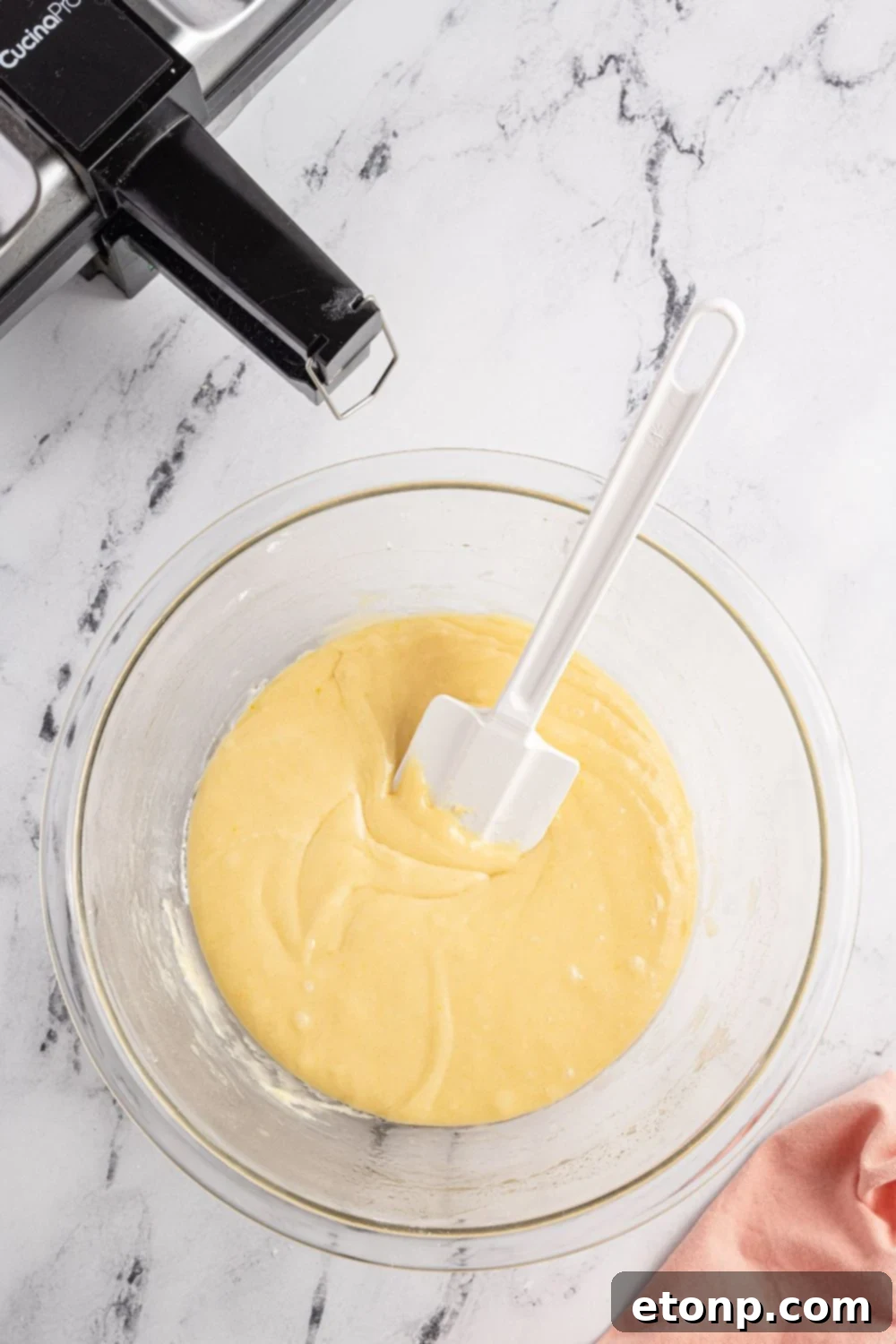 Pizzelles 11 mixing up cookie batter in a bowl