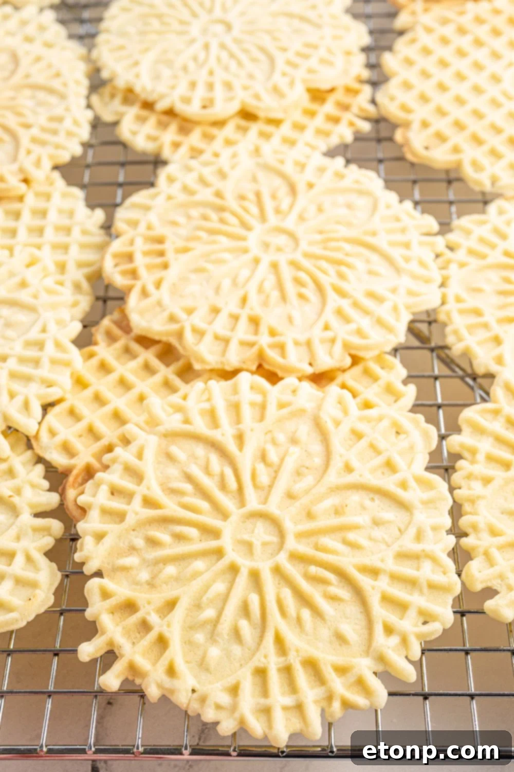 Pizzelles 16 Pizzelles on cooling tray stacked on top of each other