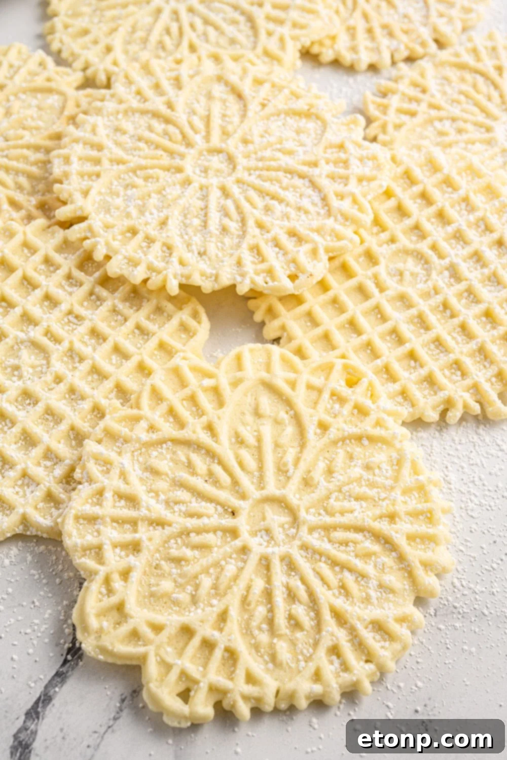 Pizzelles 19 italian cookies on a marble counter