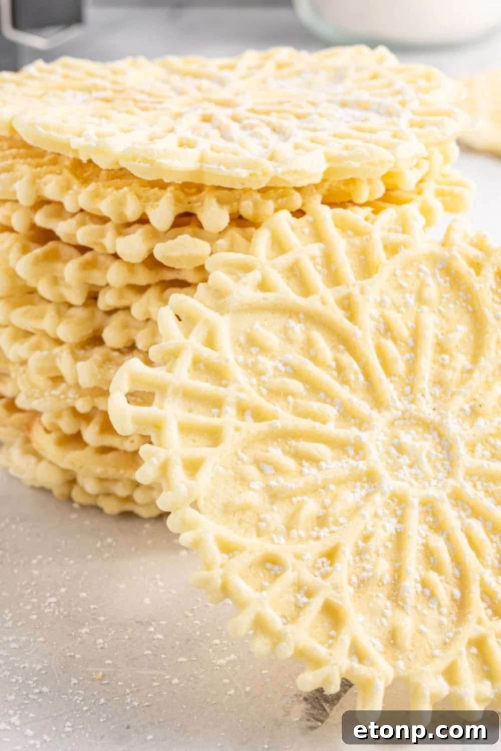 Pizzelles 24 italian cookies stacked on table