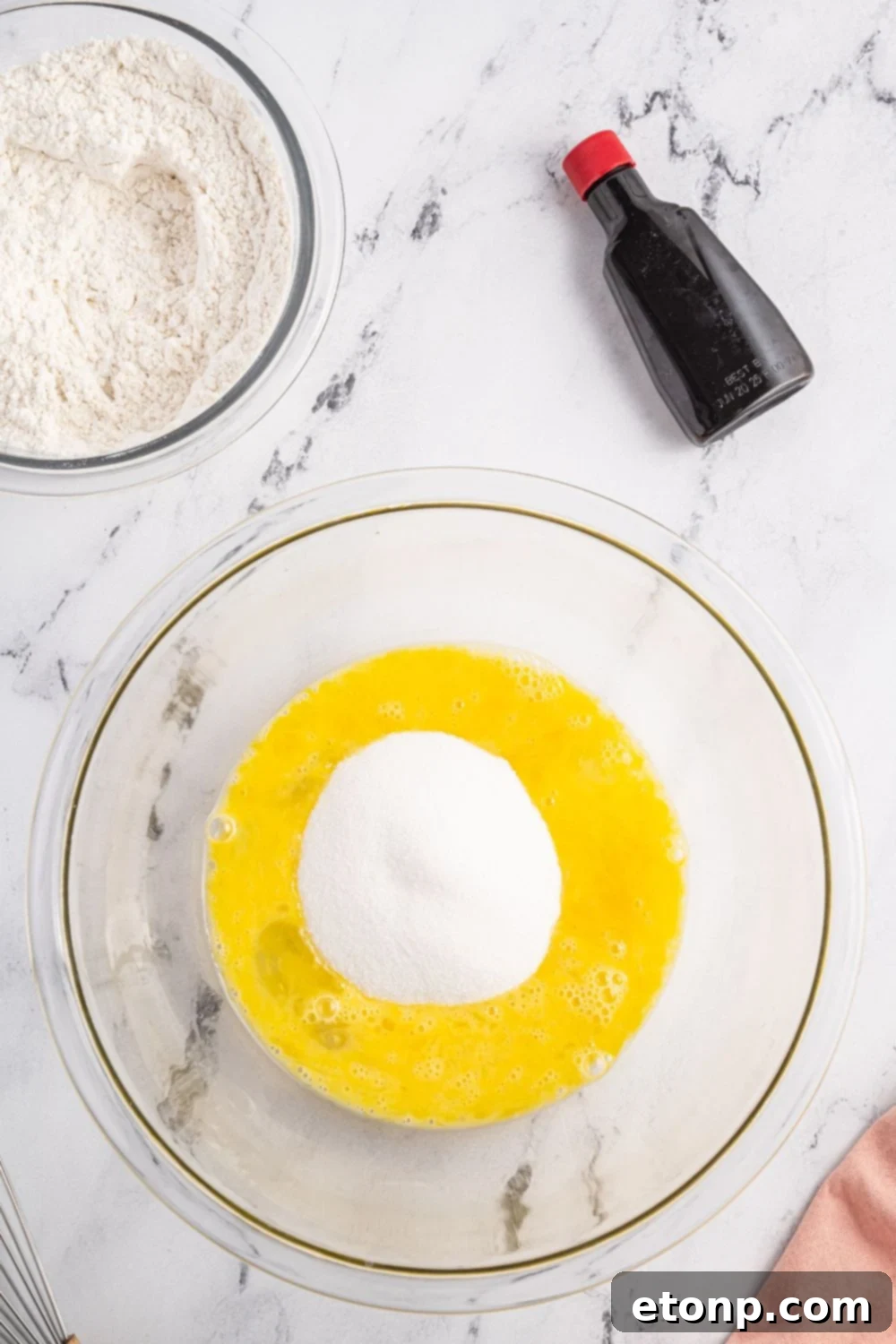 Pizzelles 9 eggs and sugar in a bowl
