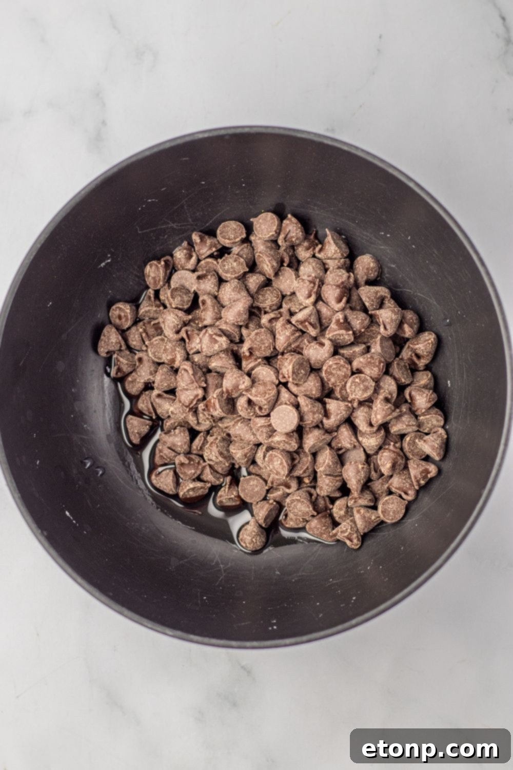 chocolate chips with oil in a bowl