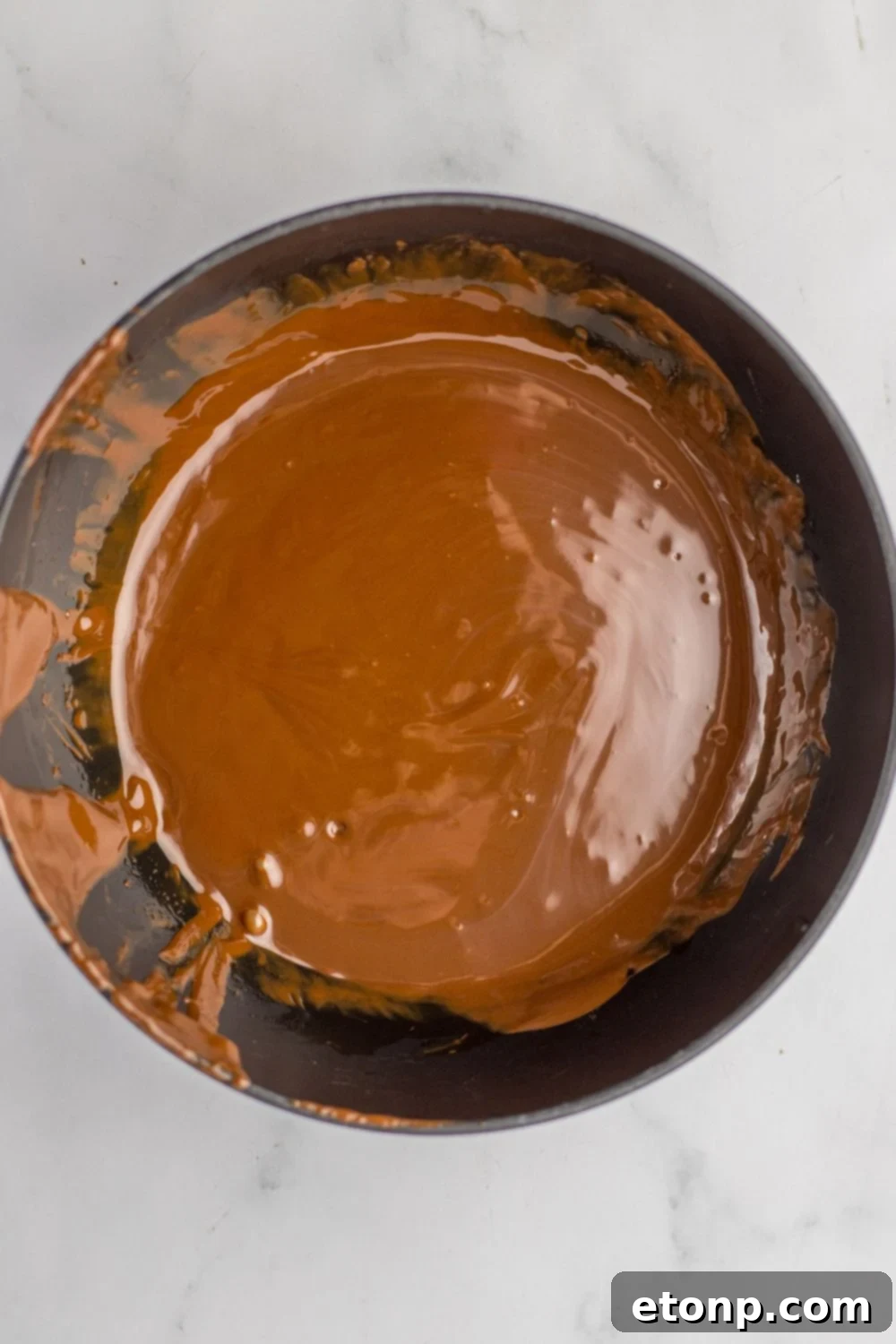 melted chocolate in a bowl on table
