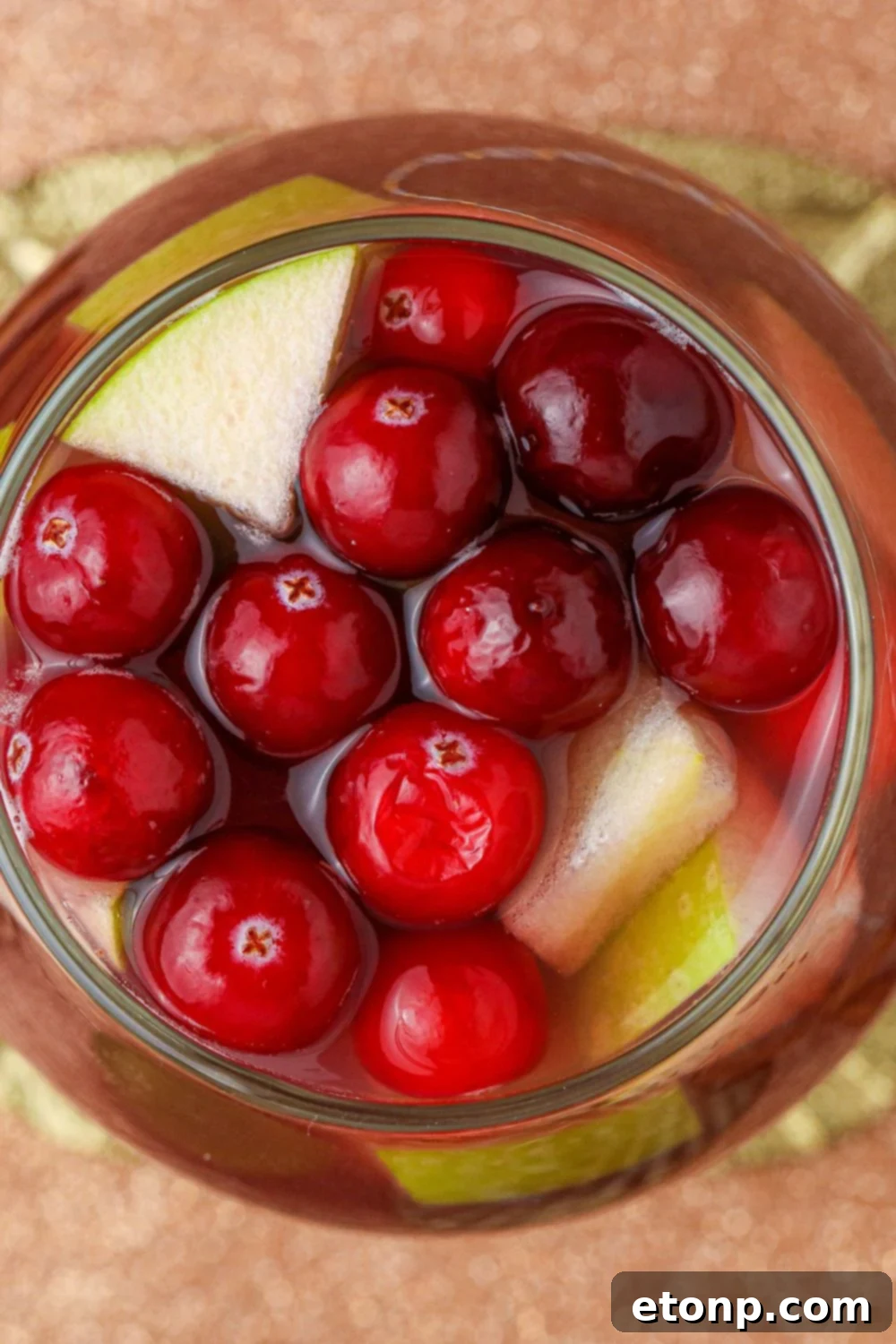 Cinnamon Spice Sangria 14 A festive cinnamon cranberry cocktail, garnished beautifully, hinting at the delightful flavors within Fireball Sangria.