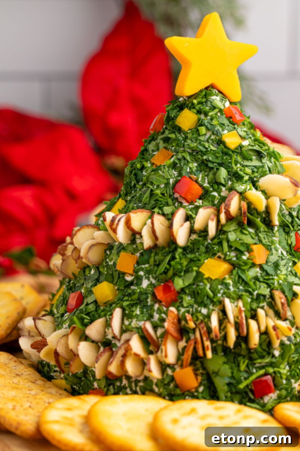 Side profile of a decorated Christmas Tree Cheeseball on a wooden table