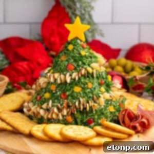 Christmas Tree Cheeseball on a platter, ready to be served