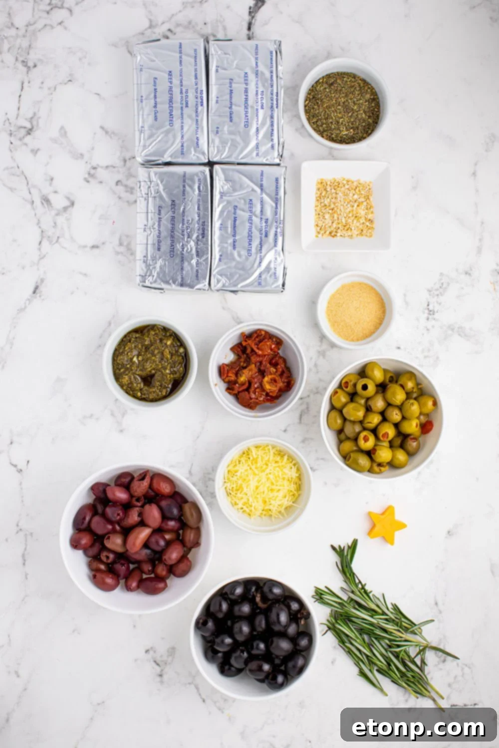 All the fresh and vibrant antipasto cheeseball ingredients laid out on a table, ready for preparation.