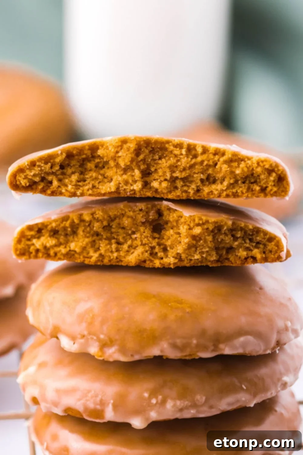 Stack of Lebkuchen Gingerbread Cookies, with one broken in half on top, revealing its soft interior