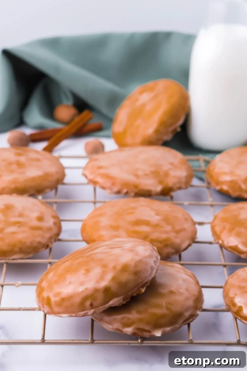 German cookies on a cooling rack with a bottle of milk in the background