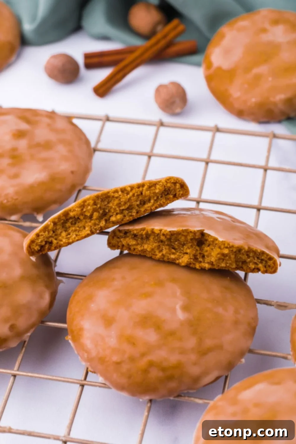 Cookies on a cooling rack, showcasing various shapes and a simple glaze