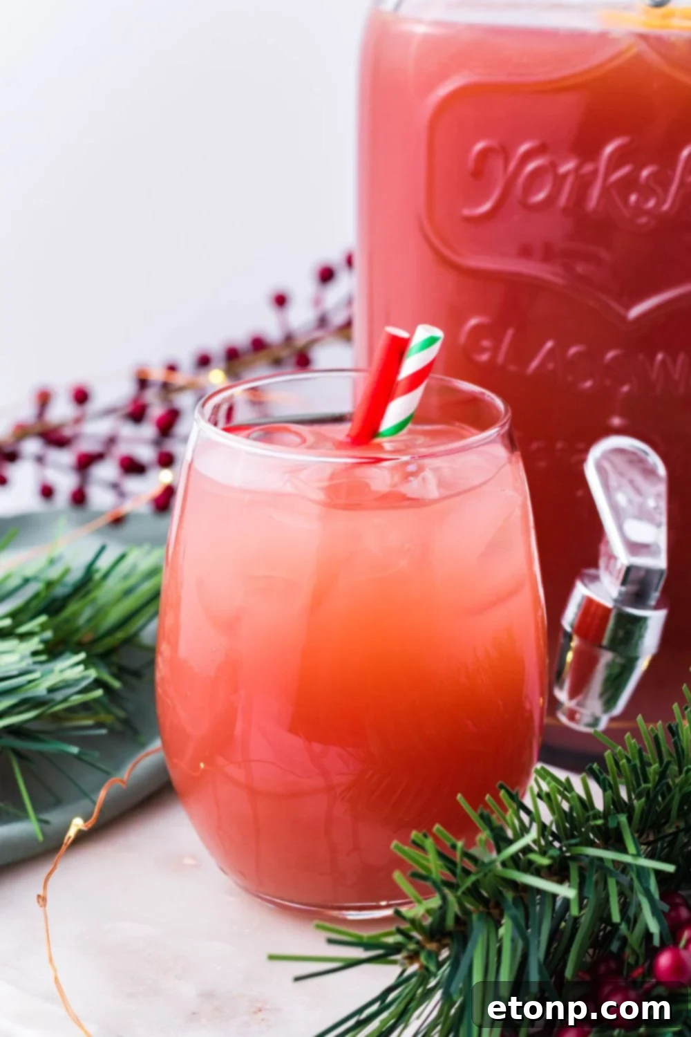 festive Christmas punch on the table with straws in it