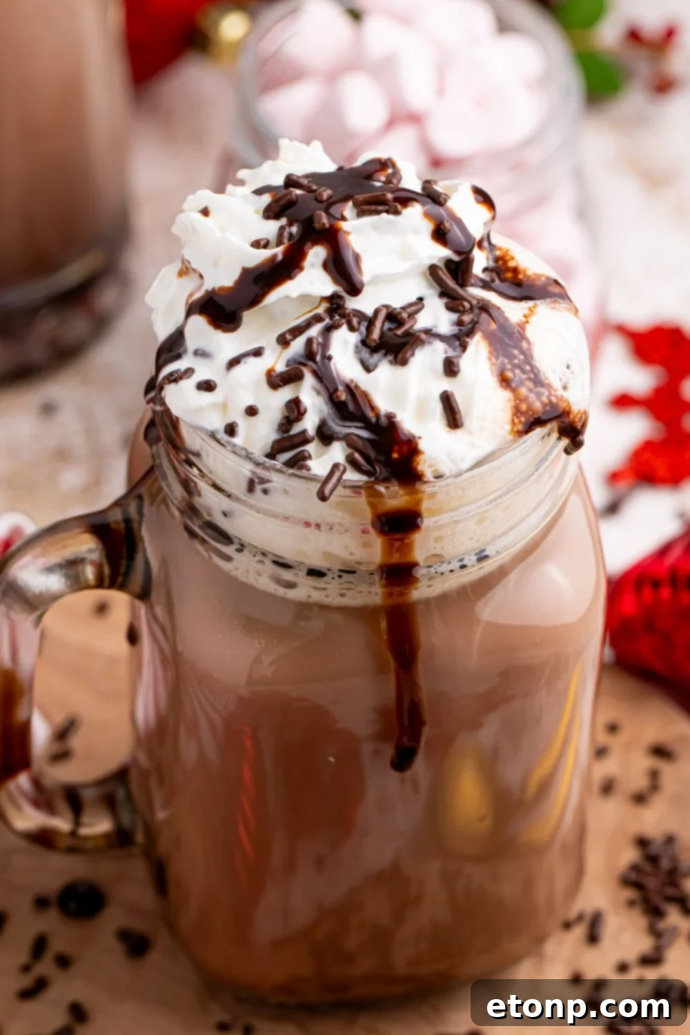 Naughty Snowman's Brew 12 chocolate syrup poured over a chocolate milkshake with sprinkles on top