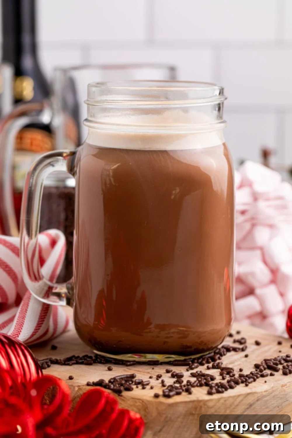 Naughty Snowman's Brew 9 hot chocolate drink on table with sprinkles scattered around it on the table
