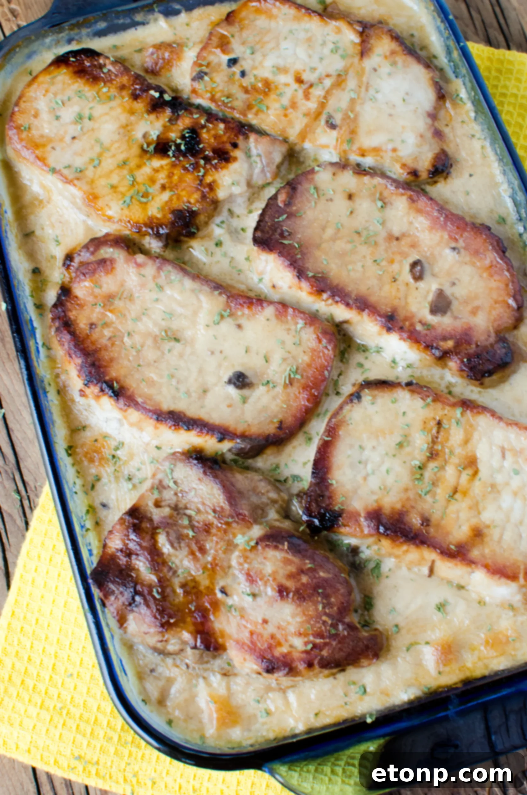 Smothered Pork Chops and Scalloped Potatoes Casserole 11 A full view of the casserole dish, highlighting the generous portions and the inviting golden crust.