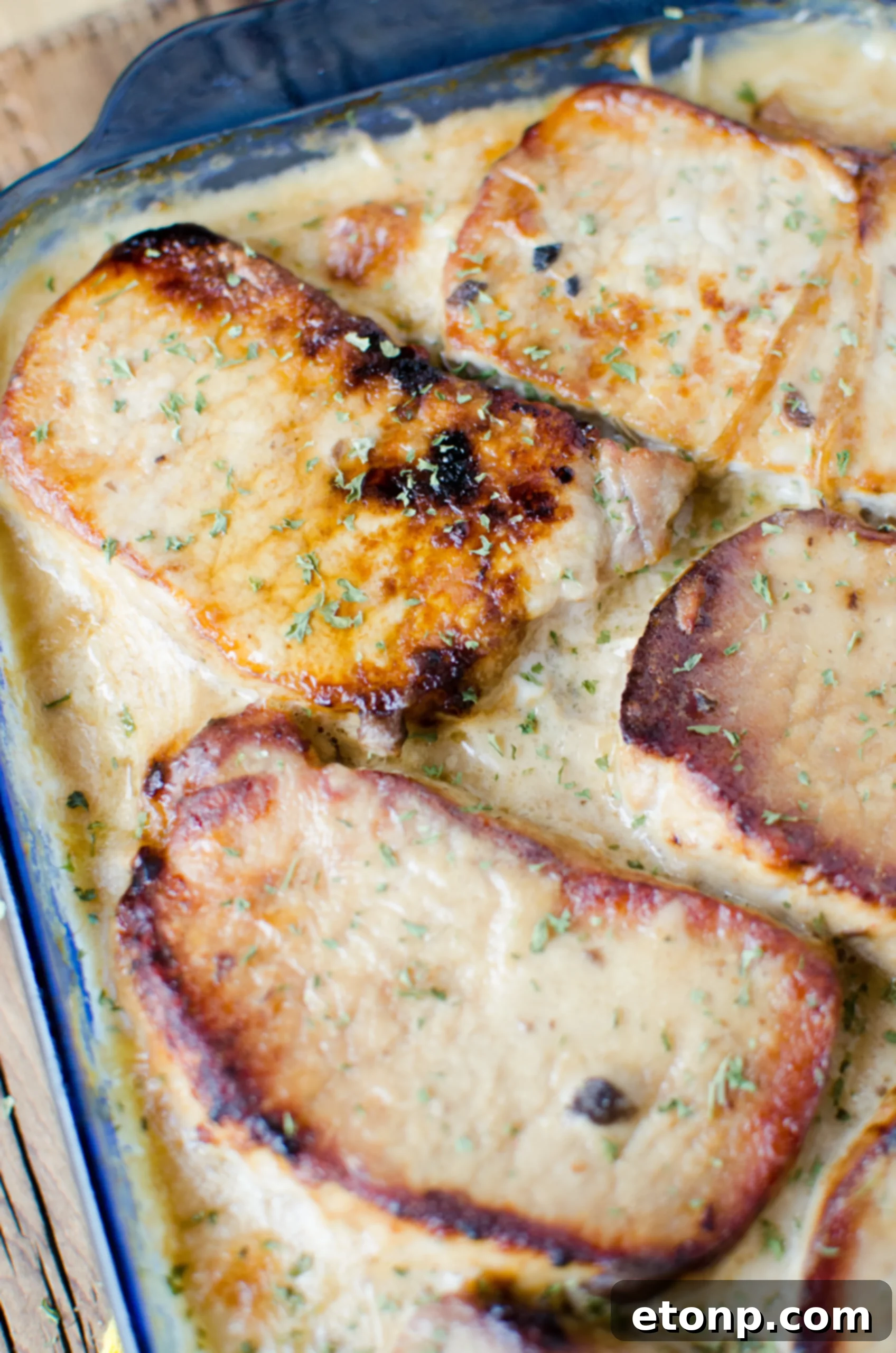 Smothered Pork Chops and Scalloped Potatoes Casserole 9 A perfectly baked Smothered Pork Chop Scalloped Potato Casserole, golden brown and bubbly, fresh from the oven.