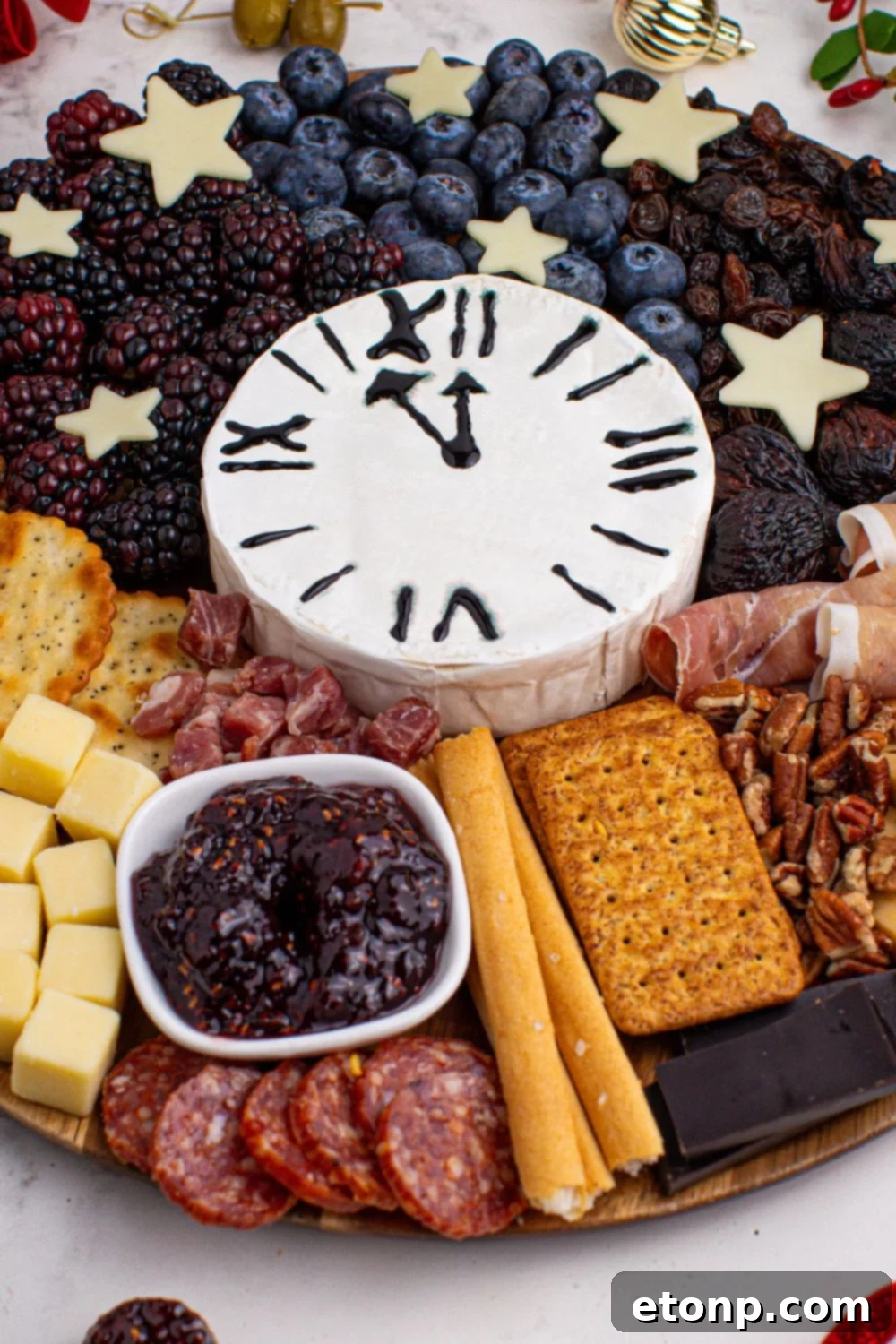 New Year's Eve Charcuterie Board on table with a close up view to see a variety of foods on the table 