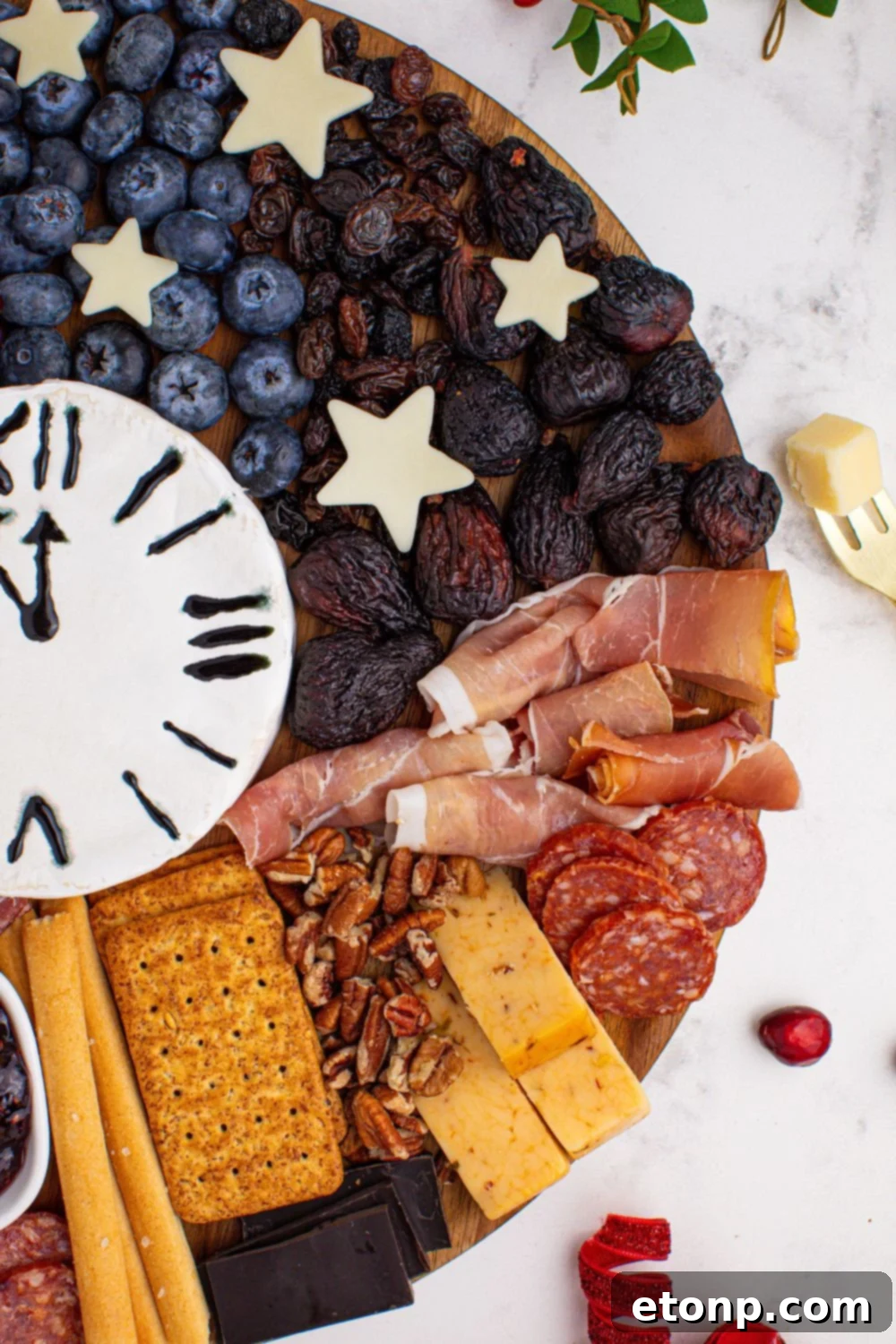 New Year's Eve Charcuterie Board side view showcasing the meats and cheese