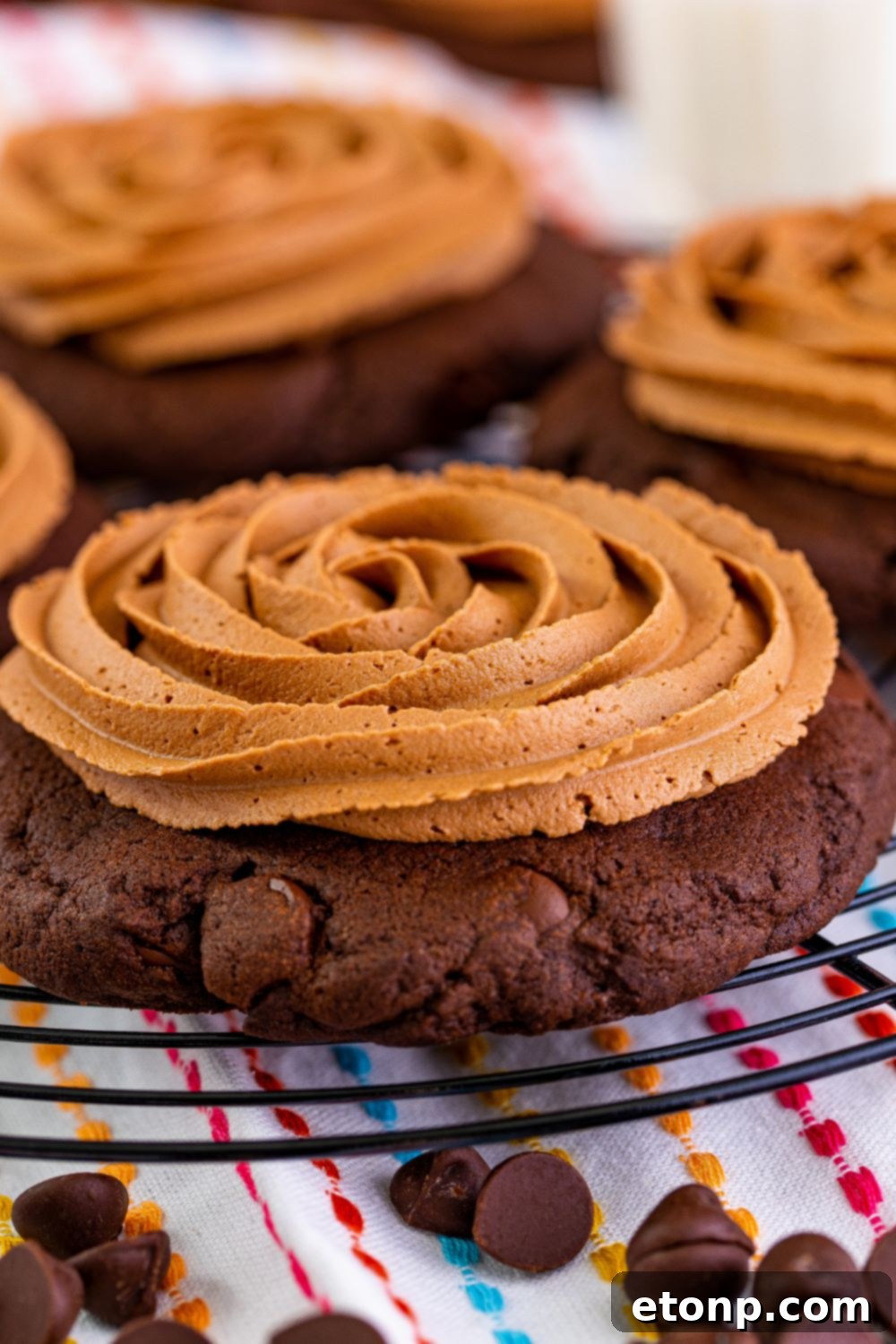 Decadent Chocolate Cake Cookies 17 Frosted chocolate cake cookies cooling on a wire tray, highlighting their soft texture and rich chocolate appearance.