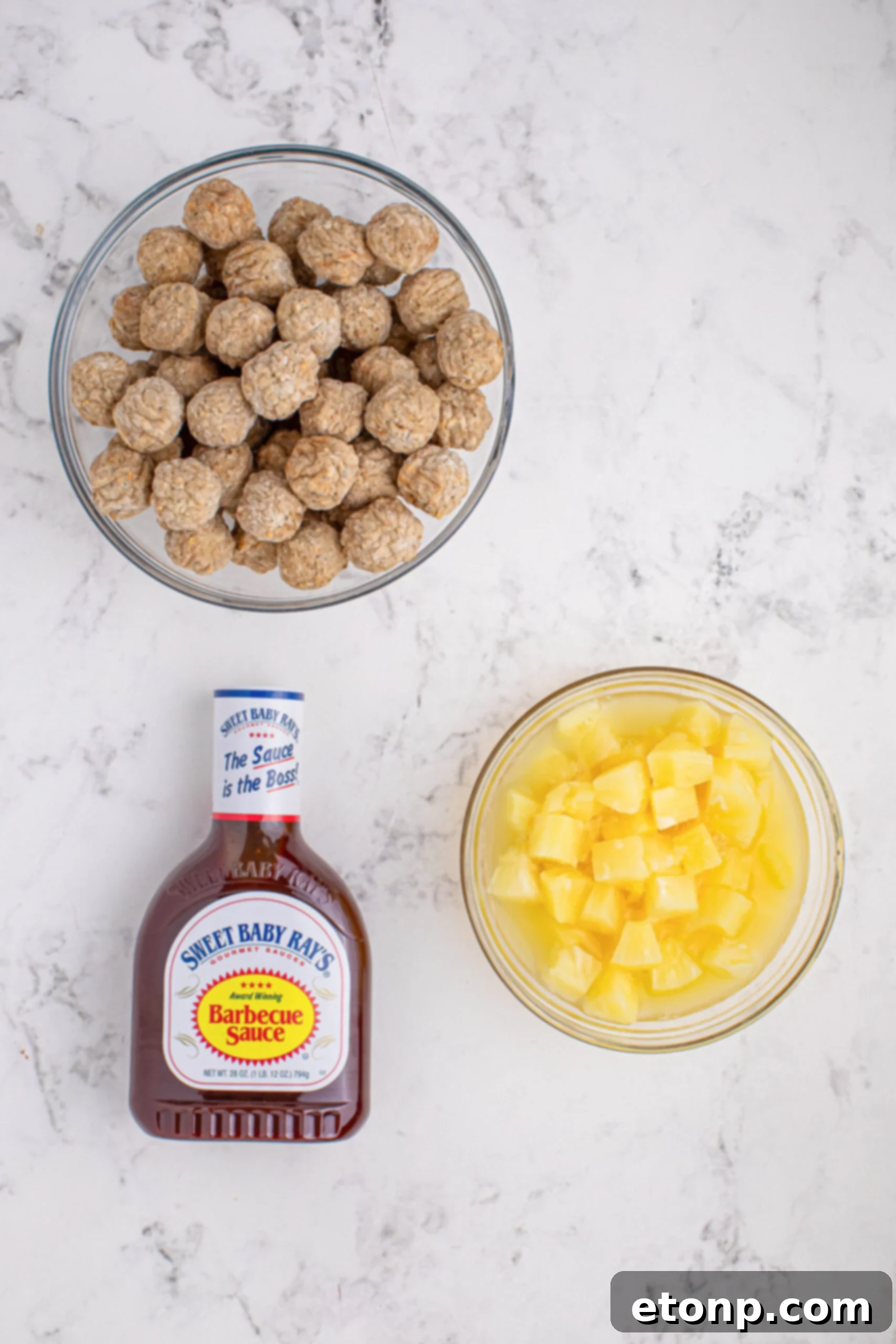 Slow Cooker 3 Ingredient Hawaiian Meatballs on table in glass bowls on table 