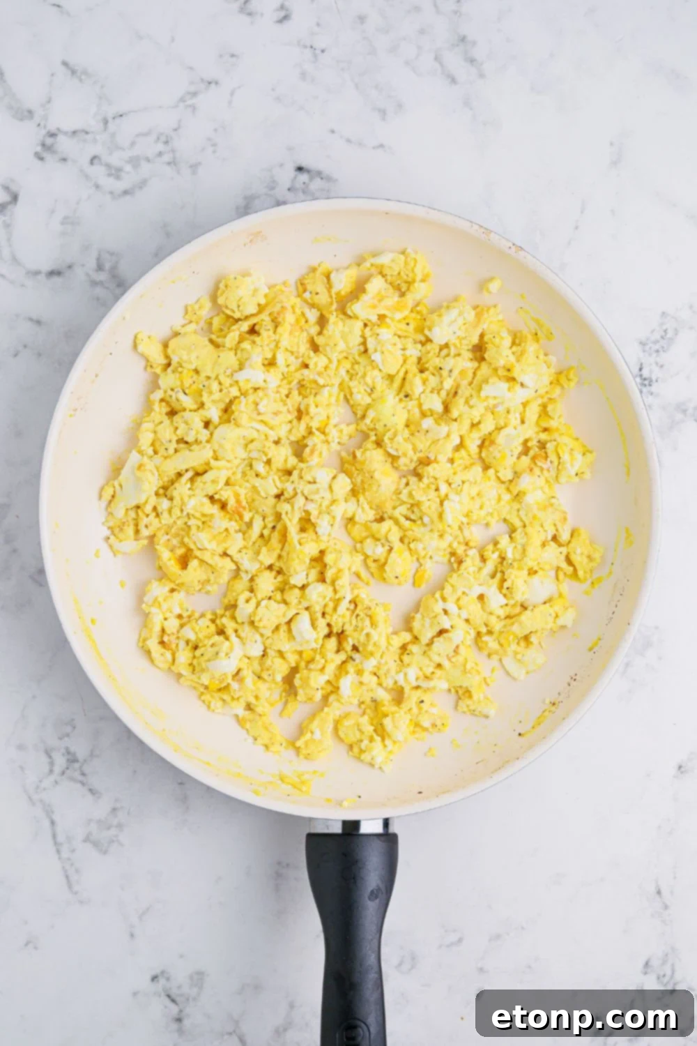 Breakfast Sliders with eggs in a skillet on the table 