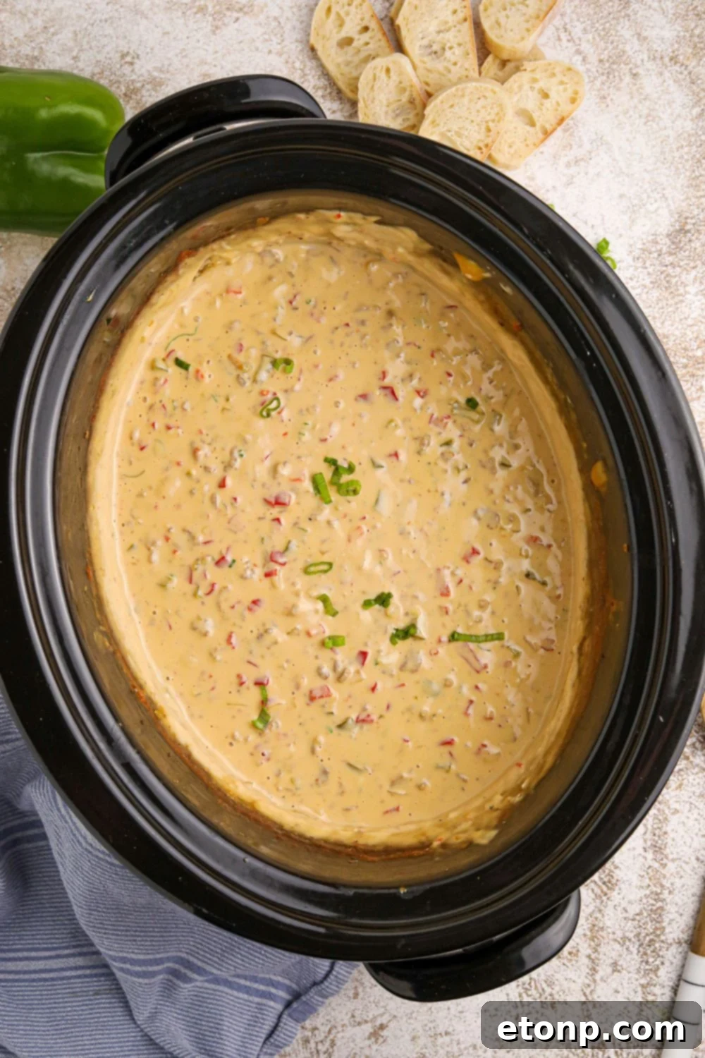 overhead view of Crock Pot Philly Cheesesteak Dip in a slow cooker sitting on counter 